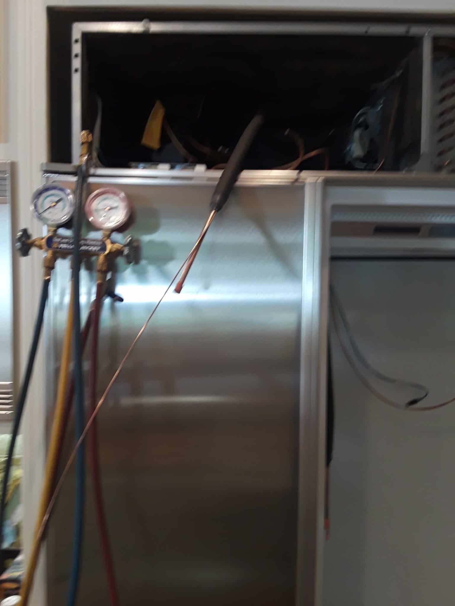 Replaced heat exchanger being placed back into unit Replaced heat exchanger being placed back into unit