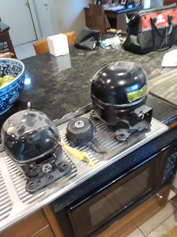 Refrigerator and Freezer compressors on either side of the compressor fan motor Refrigerator and Freezer compressors on either side of the compressor fan motor